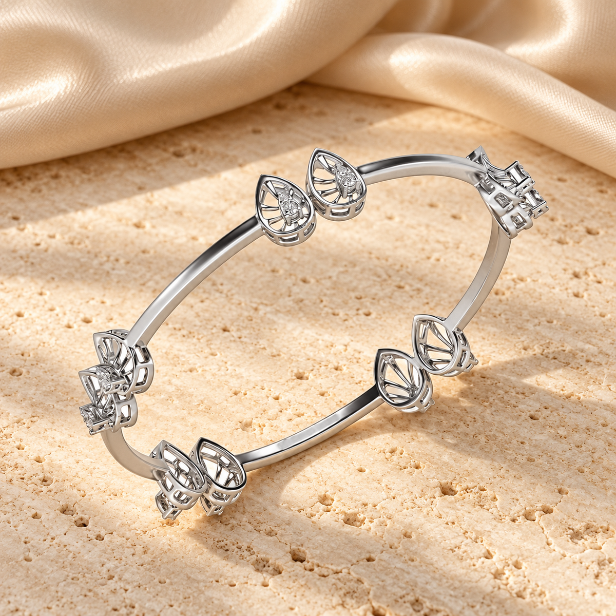 Duo Drops Silver Bangles in white gold on travertine and champagne silk