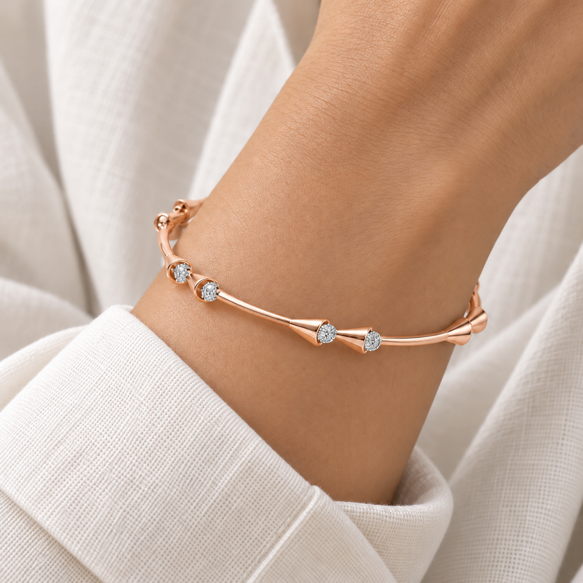 Drop-lays Rose Gold Bangle worn on wrist