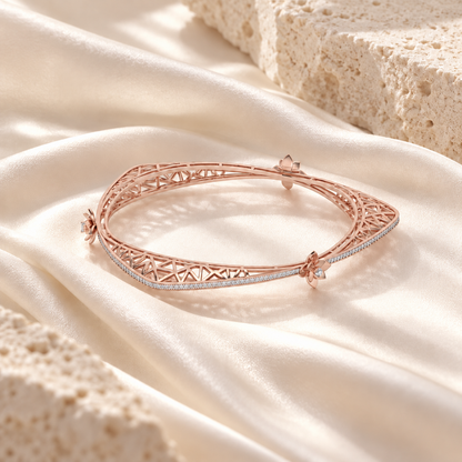Finlay Rose Gold Bangles laid on ivory silk and warm limestone