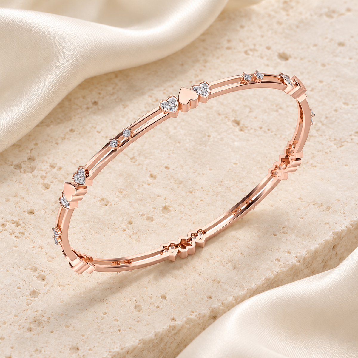 Heartly Silver Bangles in Rose Gold on an ivory silk and stone editorial setting
