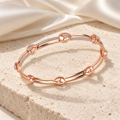 Hourglass Silver Bangles in Rose Gold on an ivory silk and stone editorial setting