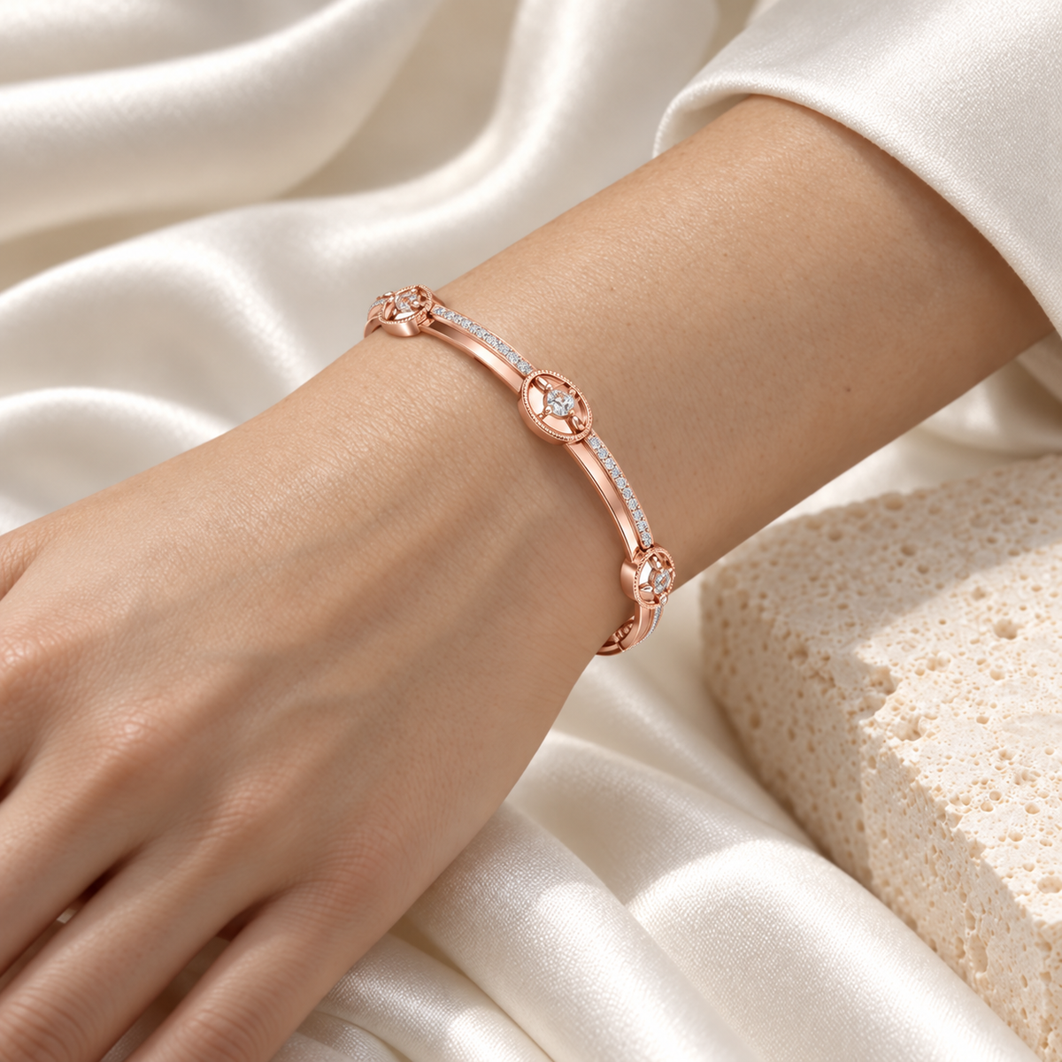 Hourglass Silver Bangles Rose Gold worn on wrist - editorial model photo