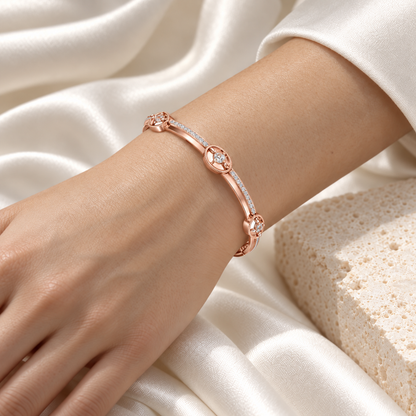 Hourglass Silver Bangles Rose Gold worn on wrist - editorial model photo