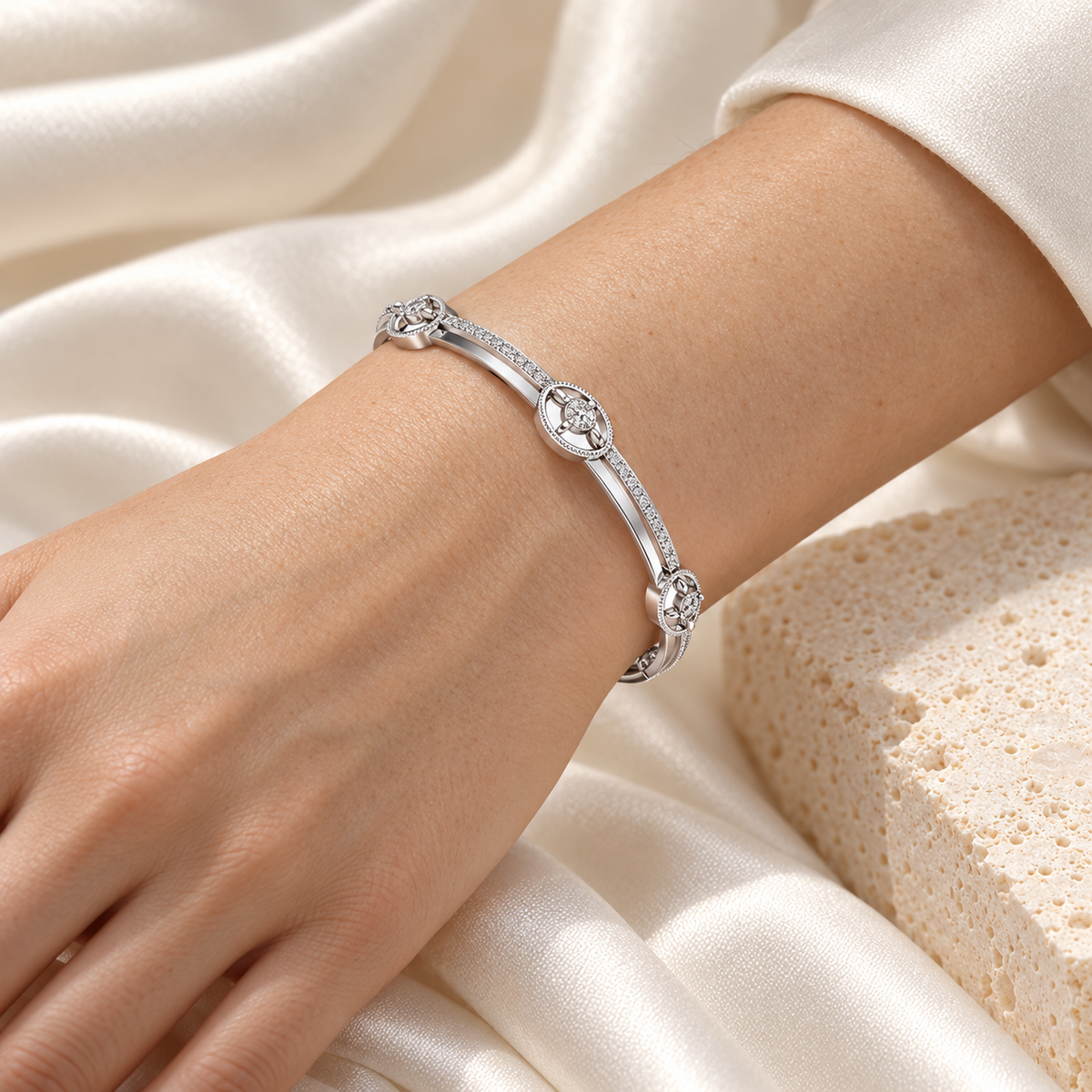 Hourglass Silver Bangles in white gold worn on wrist