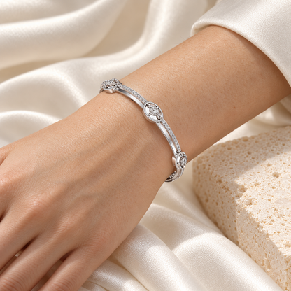 Hourglass Silver Bangles in white gold worn on wrist